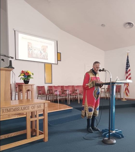 Bernice speaking at the lectern during a worship service