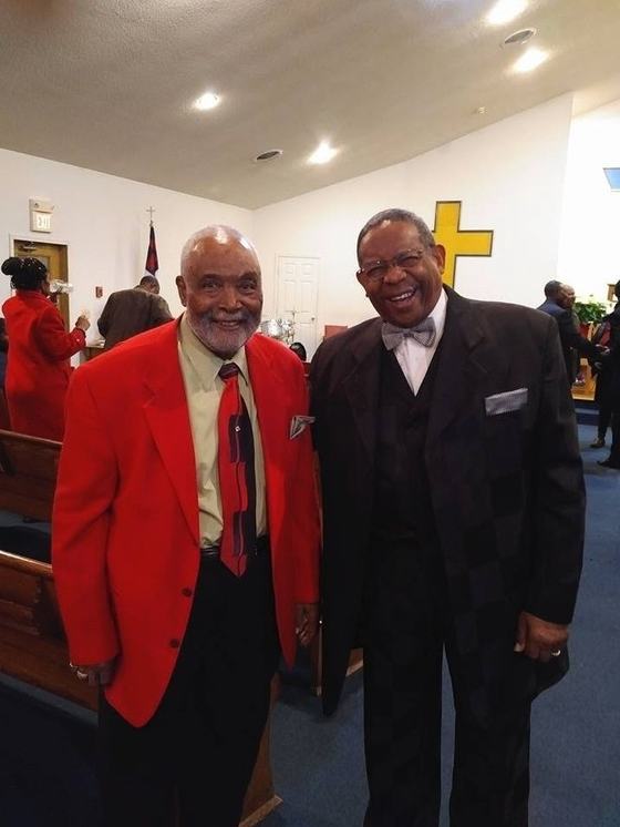 Mr. Landel and Rev. Collins smiling together in the sanctuary