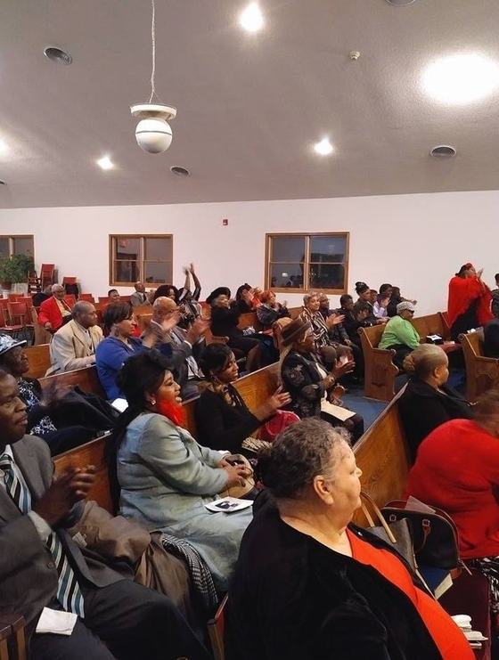 Members and guests filling the pews during Sunday worship